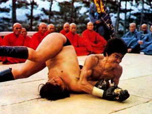 Sammo Hung gets pinned by Bruce Lee in "Enter the Dragon"