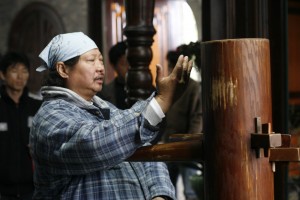 Sammo Hung, on the set of "Ip Man," demonstrating the use of the wooden dummy, a training device associated with the Wing Chun martial arts style. 