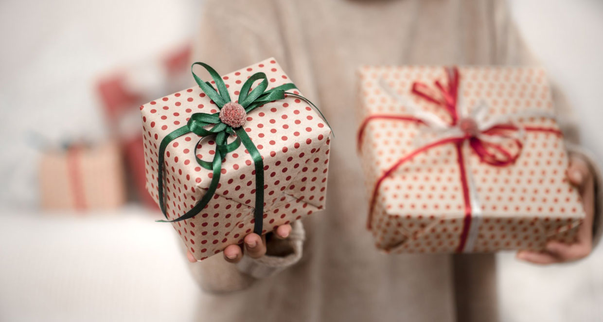 Woman holding two gifts